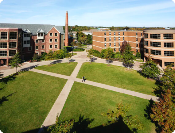 A quad at Mount Allison University. A central pat criss-crosses between two campus buildings. Nimbus Learning is partnered with leaders in student learning services. See how these organizations are using our platform to improve tutoring in university.